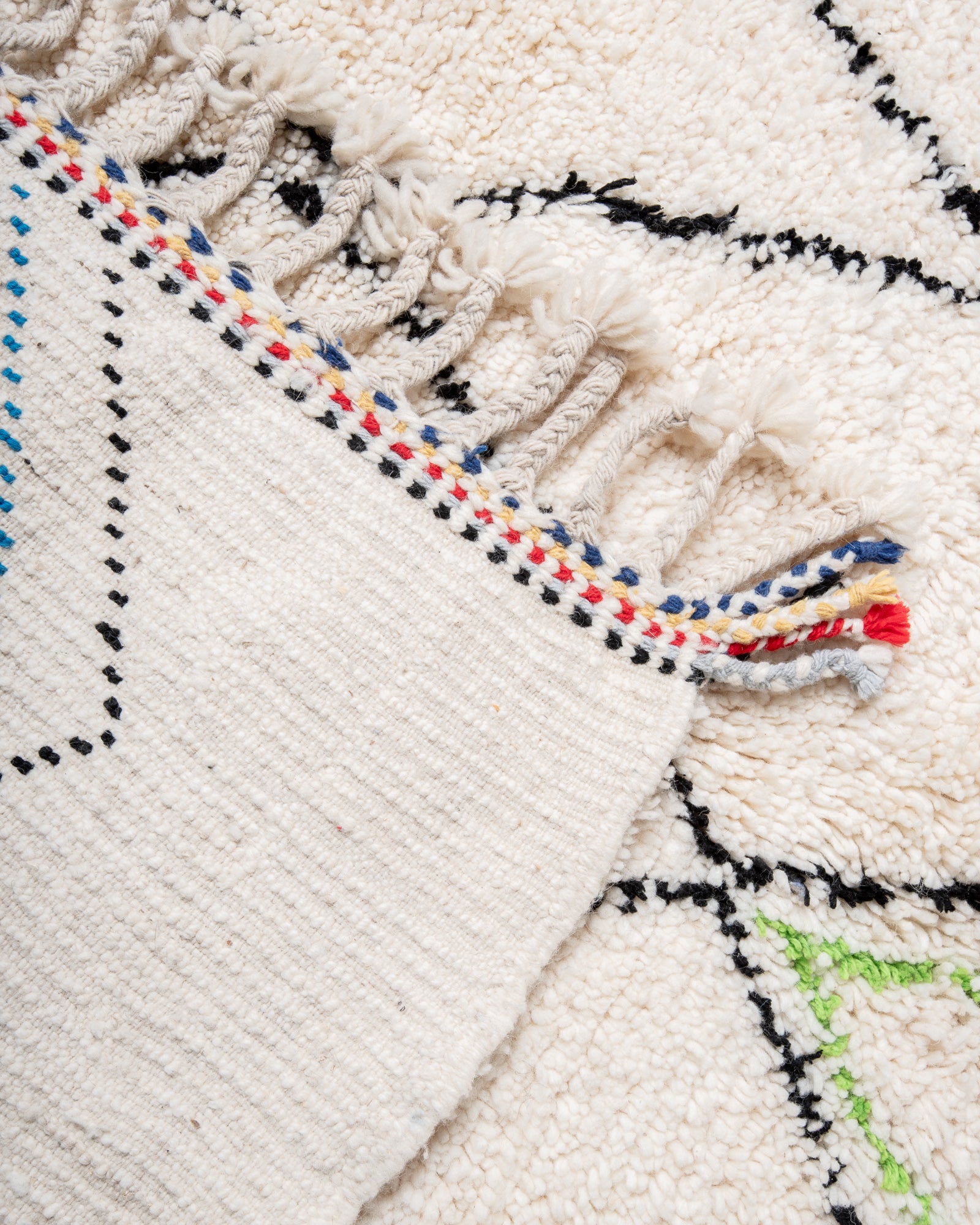 Modern, designer, handcrafted Berber rug from Morocco. Beniourain carpet with beautiful colours and patterns and fluffy wool texture.